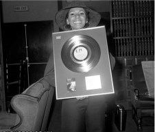 Shirley with the Gold Disc she received for The Singles Album